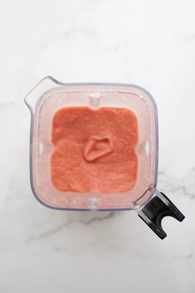 pink-ish blended smoothie in a blender