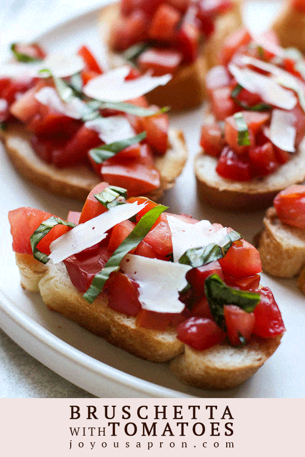 Bruschetta with Tomatoes - A light, healthy and no cook appetizer that is super easy to make! Tomatoes and basil are tossed in a balsamic vinegar mixture and spread onto a toasted slice of French bread. Perfect for a light lunch, Spring and Summer cookout, snack, parties, showers and much more! via @joyousapron