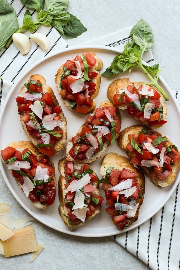 Top down view of a plate of Bruschetta with Tomatoes, Basil and Balsamic Vinegar