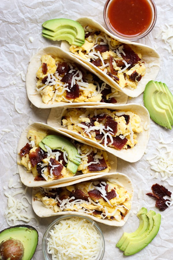 Five Breakfast Tacos filled with eggs, bacon and avocado