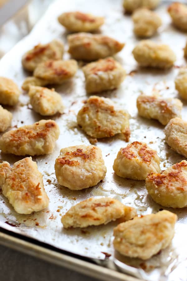 Baked chicken on baking sheet