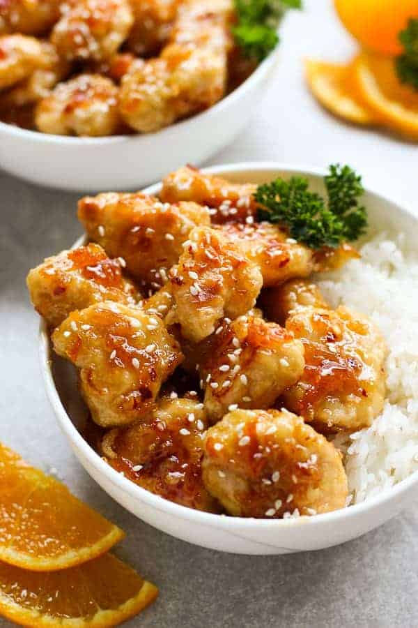 A bowl of Easy Baked Orange Chicken with rice