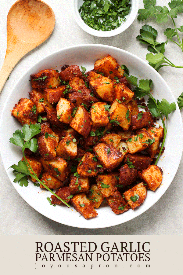 Roasted Garlic Parmesan Potatoes - Crispy on the outside and soft on the inside, these potatoes are seasoned with garlic and parmesan and flavorful herb, and oven baked to perfection! Easy side dish! via @joyousapron