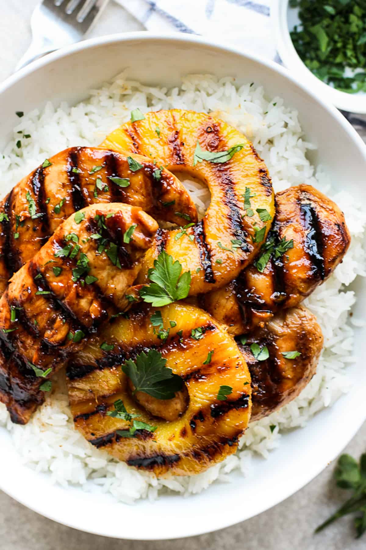 A top down view of a bowl of Hawaiian Chicken with Coconut Rice