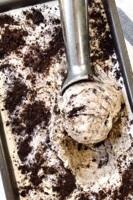 Scooping out a scoop of cookies and cream ice cream