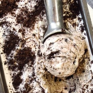 Scooping out a scoop of cookies and cream ice cream