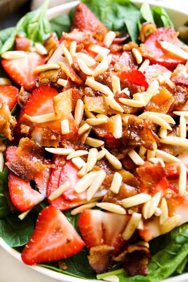 Strawberry and Bacon and almonds on a bed of spinach