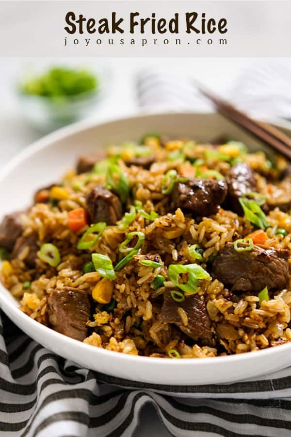 Steak Fried Rice - delicious Asian fried rice recipe with beef. Combines juicy, marinated steak pieces, rice and veggies. An easy and yummy one pan meal! via @joyousapron