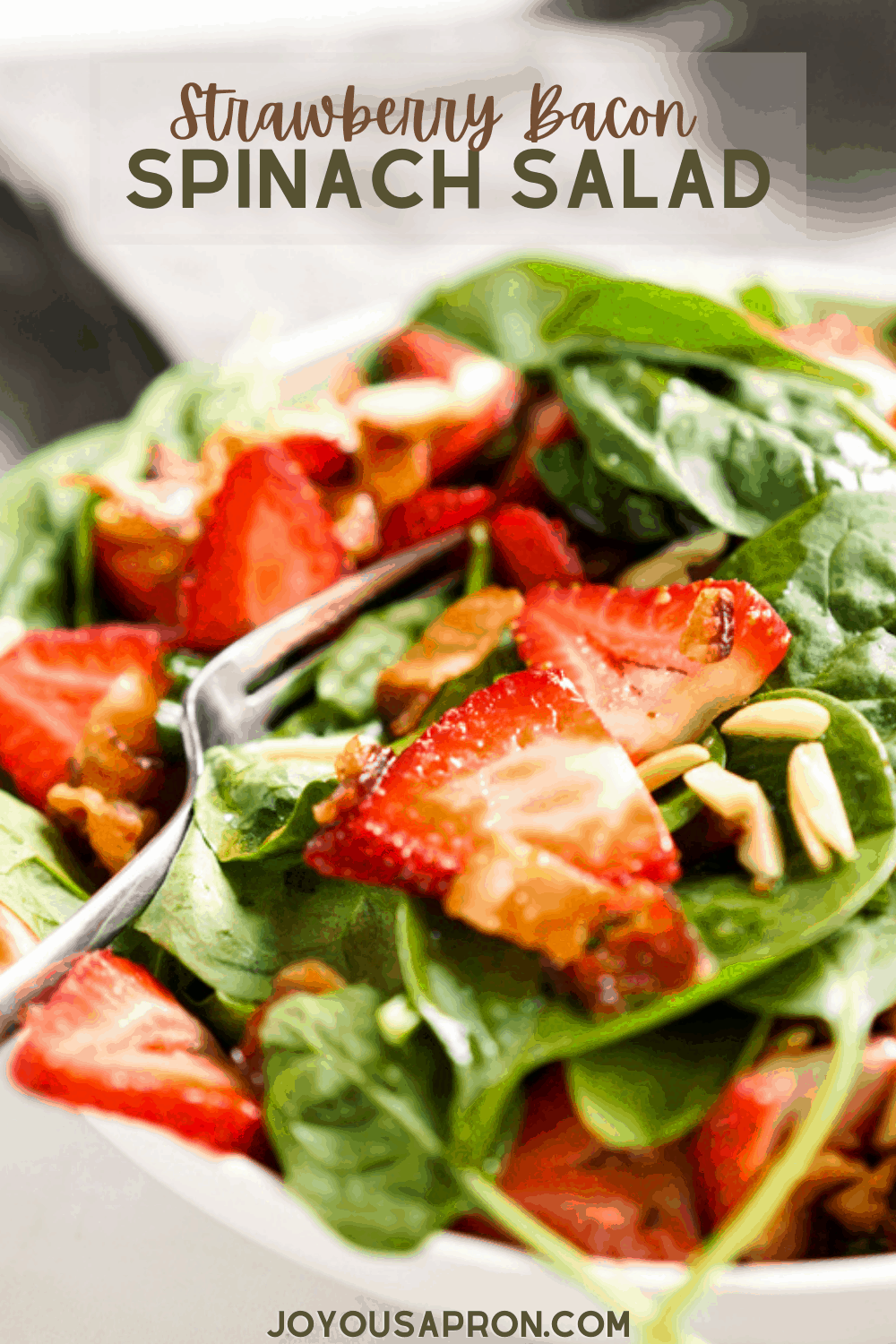 Strawberry Bacon Spinach Salad with Lemon Maple Dressing - healthy and easy salad for summer cookouts or dinners. A bed of fresh spinach topped with strawberries, bacon and slivered almonds, drizzled with a lovely, highly flavorful homemade lemon maple dressing. via @joyousapron