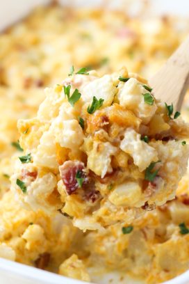 scooping out bacon potato casserole