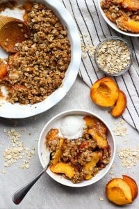 Easy peach crisp with a scoop of vanilla ice cream