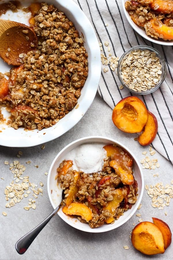 Easy peach crisp with a scoop of vanilla ice cream