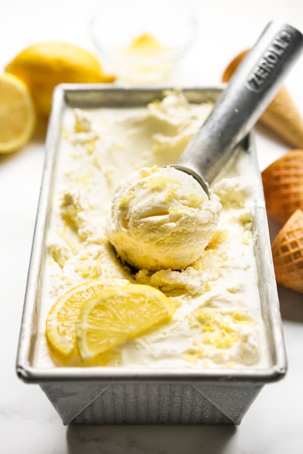 Scooping Lemon Ice Cream from a rectangular tub