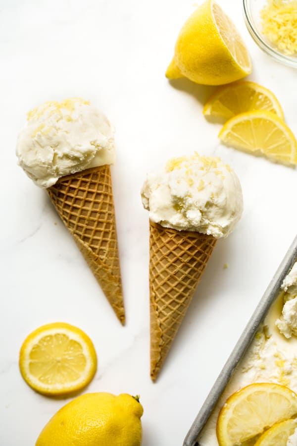 Lemon Ice Cream on a tub with lemons on top