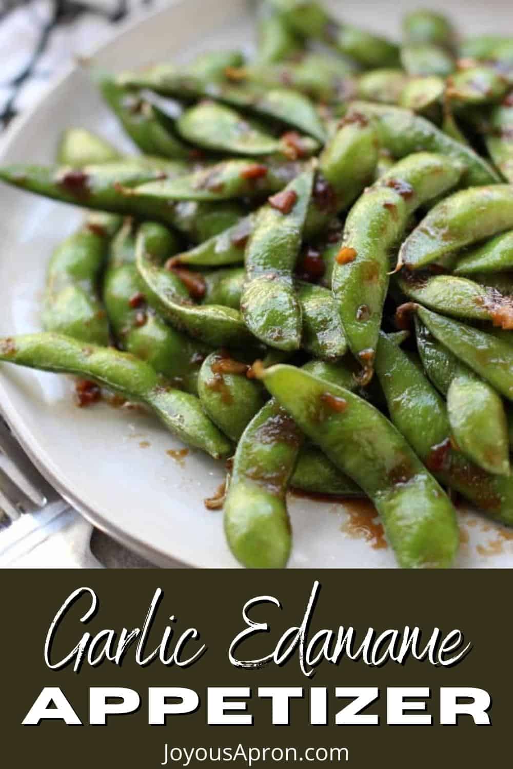 Garlic Edamame - An easy, healthy Asian-Inspired low carb veggie side or appetizer! Edamame sautéed and coated in a sticky, garlicky soy based sauce. 10 minutes from start to finish! The perfect way to kick off sushi or any Asian-inspired meal! Vegan and vegetarian. via @joyousapron