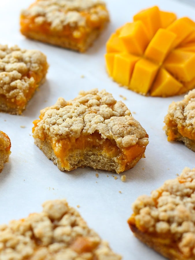 Mango Crumb Bars that is biten into