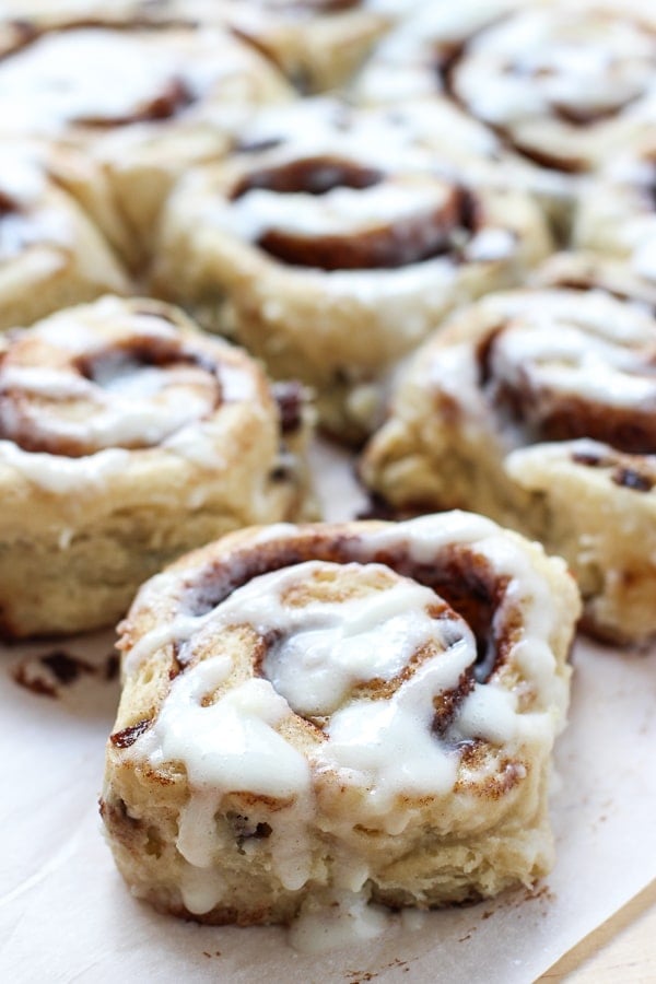 Close up of a Cinnamon Raisin Roll topped with icing 