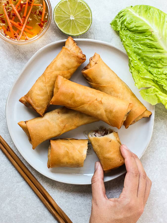 Grabbing a piece of Vietnamese Egg Rolls