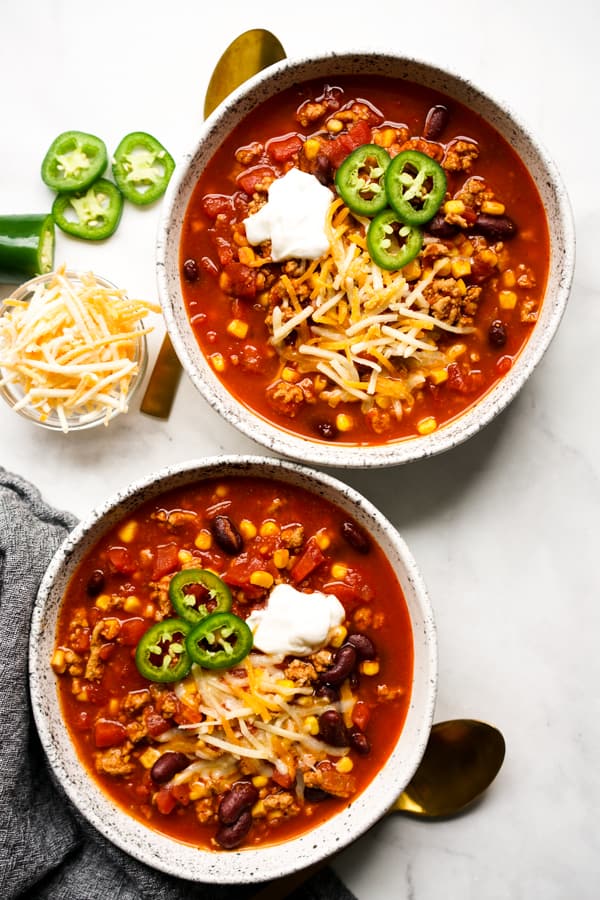 Top down view of two bowls of Healthy Turkey Chili