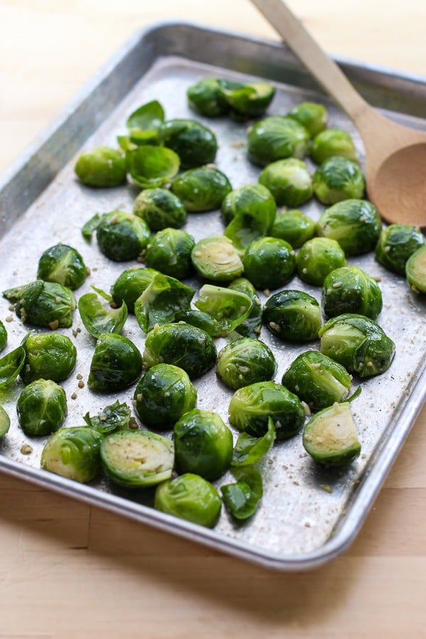 Brussel sprouts on a baking tray, ready to make Honey Roasted Brussel Sprouts and Bacon