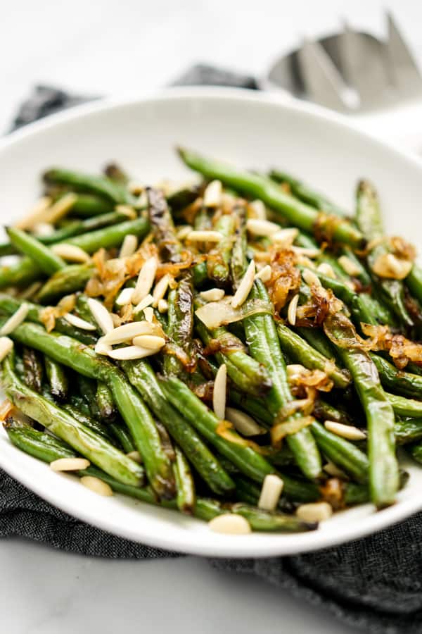 Side with of a plate of Caramelized Onions Sautéed Green Beans