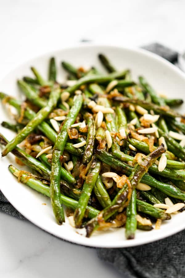 Side view of a plate of Caramelized Onions Sautéed Green Beans