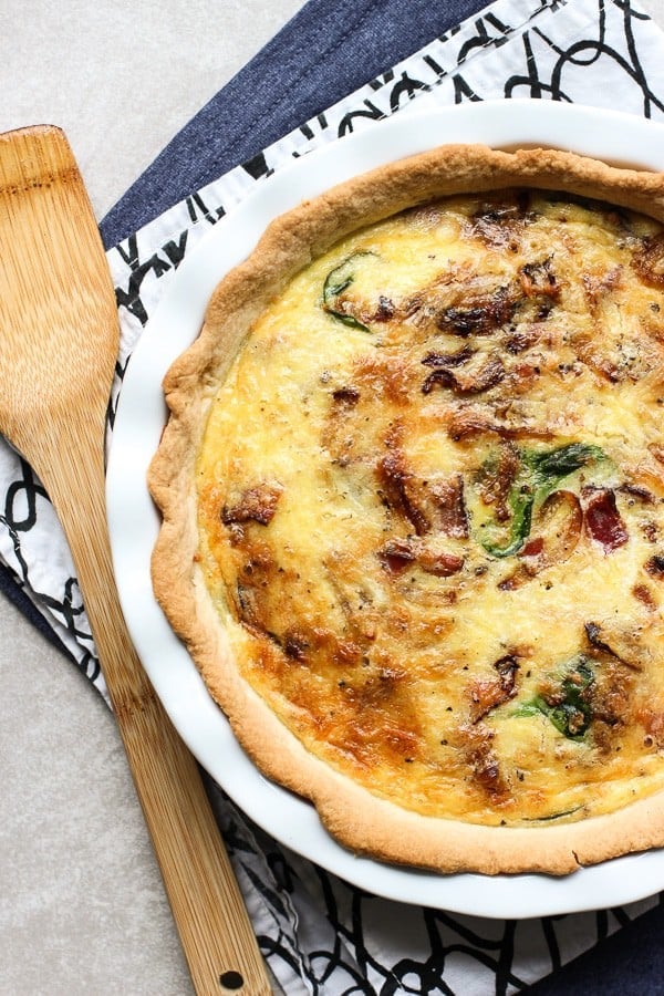 Quiche with a spatula next to it