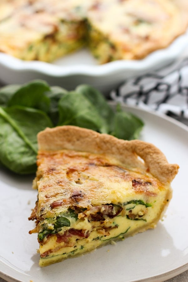 A slice of Bacon Spinach Cheddar Quiche