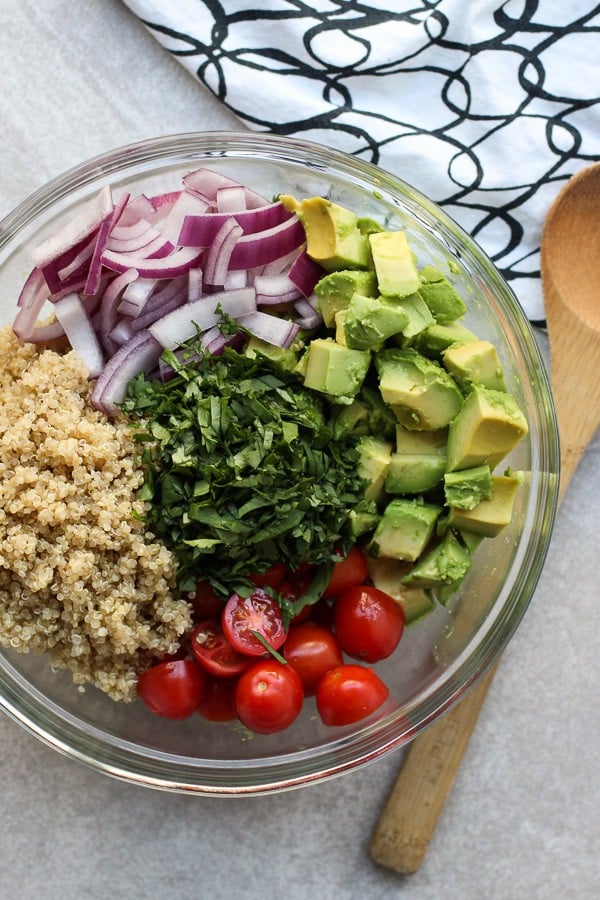 A bowl of ingredients for Avocado Quinoa Salad