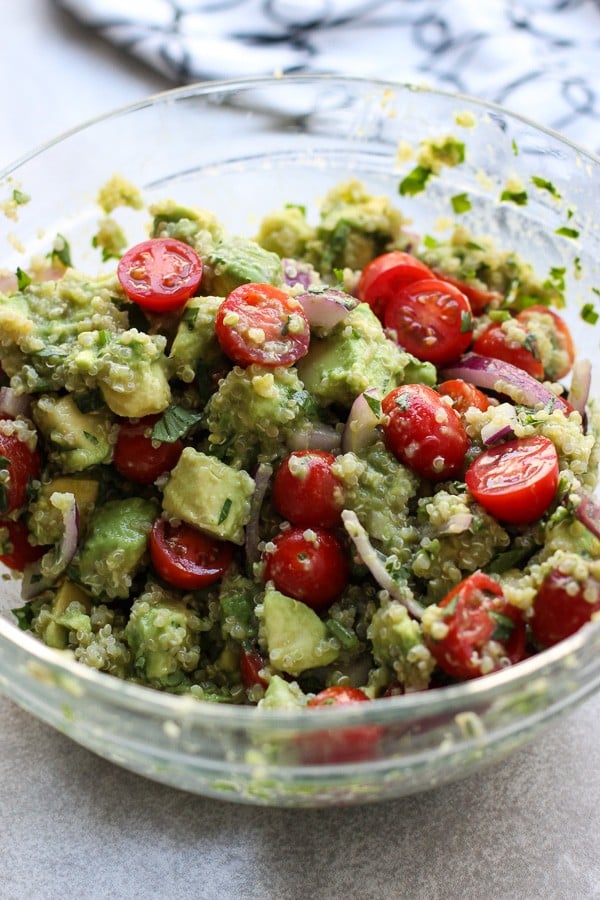 Mixing Avocado Quinoa Salad in a bowl