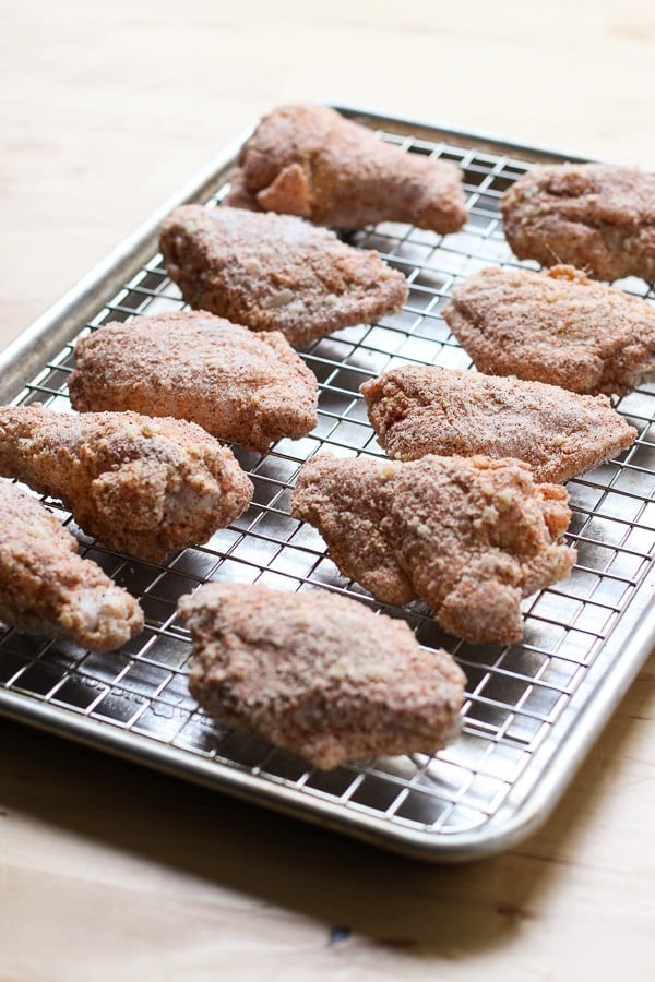 Uncooked Baked Garlic Parmesan Chicken Wings placed on a baking rack