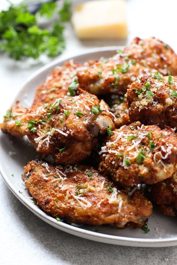 up close of a plate of Baked Garlic Parmesan Chicken Wings