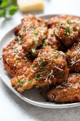 Up close of a plate of Baked Garlic Parmesan Chicken Wings