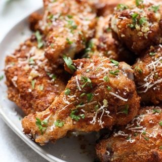 Up close of a plate of Baked Garlic Parmesan Chicken Wings