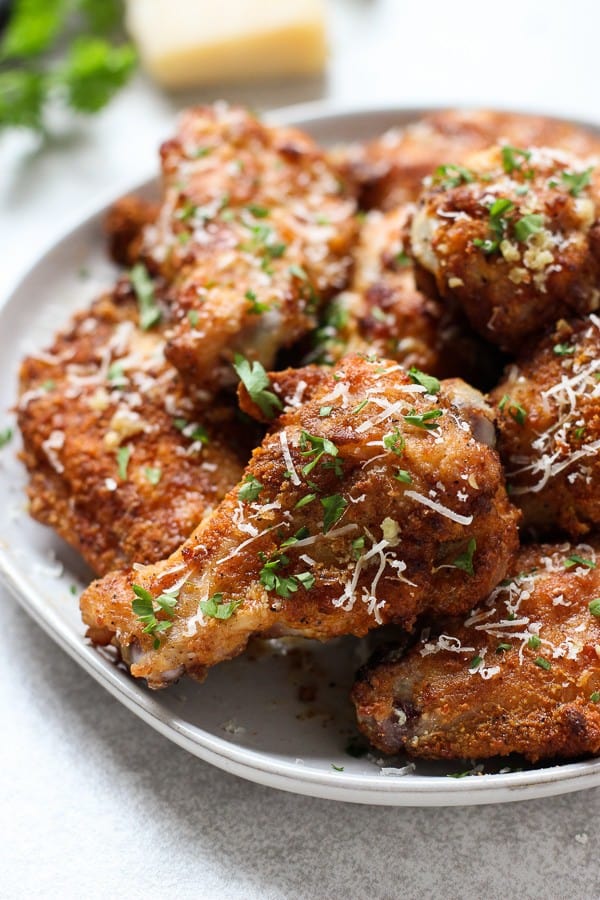 Up close of a plate of Baked Garlic Parmesan Chicken Wings