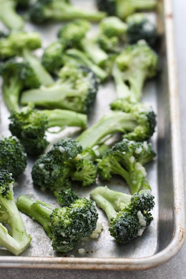 Uncooked Roasted Lemon Garlic Broccoli on a baking sheet