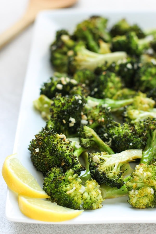 Up close of a rectangular plate of Roasted Lemon Garlic Broccoli