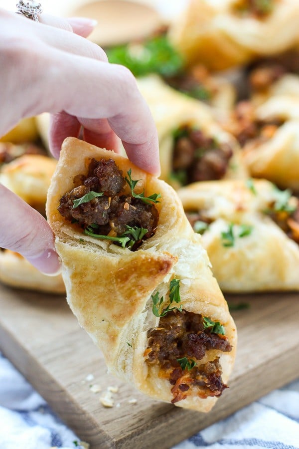 Hand holding a Sausage and Cheese Puff Pastry Pocket