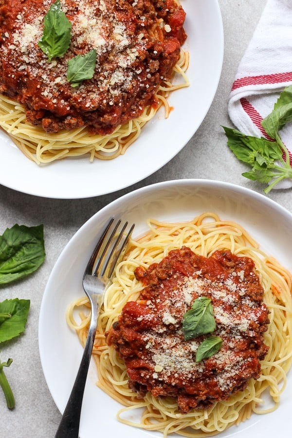 Overhead shot of two plates of The Best Spaghetti and Meat Sauce