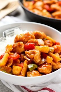 A bowl of Sweet and Sour Chicken with rice