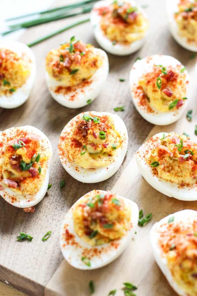 Bacon Deviled Eggs on a wooden block