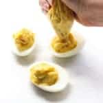 Using a ziplock bag to squeeze yolk mixture into egg