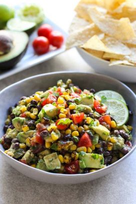 Avocado Corn and Black Bean Salsa with a bowl of chips on the side