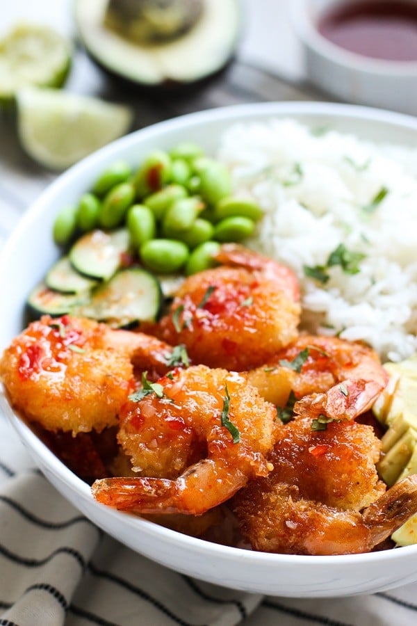 Closeup of Crispy Shrimp Bowl with sauce in the background