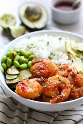 Crispy Shrimp Bowl with avocado and sauce in the background