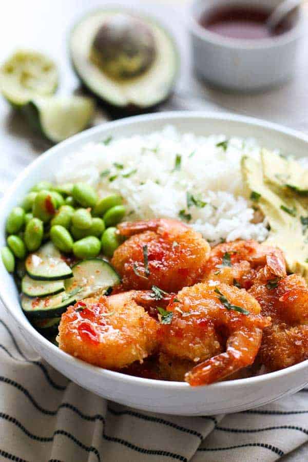 Crispy Shrimp Bowl with avocado and sauce in the background