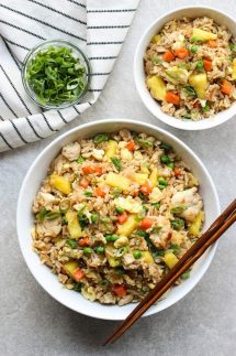 A large bowl and a small bowl of Thai Pineapple Fried Rice