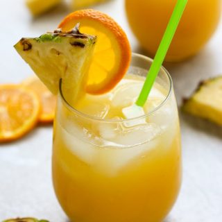 Two glasses of Orange and Pineapple Coconut Rum Cocktail