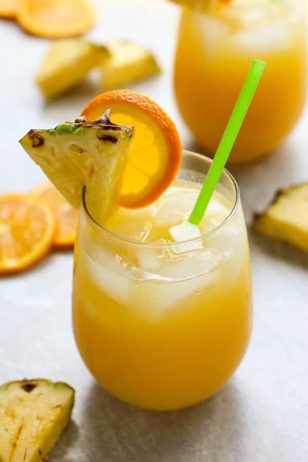 Two glasses of Orange and Pineapple Coconut Rum Cocktail