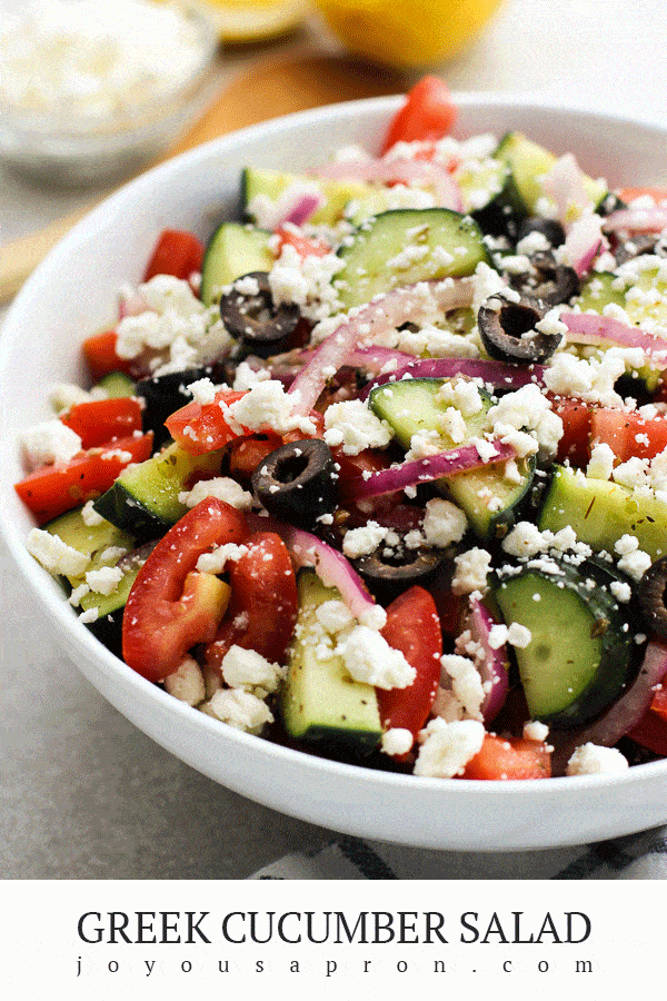 Greek Cucumber Salad - healthy and easy no cook vegetable side dish, perfect for summer dinners and cookout. Cucumbers, tomatoes, red onions, black olives, and feta tossed in a zesty homemade Greek Lemon Vinaigrette dressing. via @joyousapron